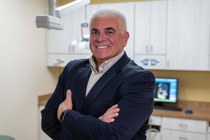 Dr. Najari's patient AL smiling in office