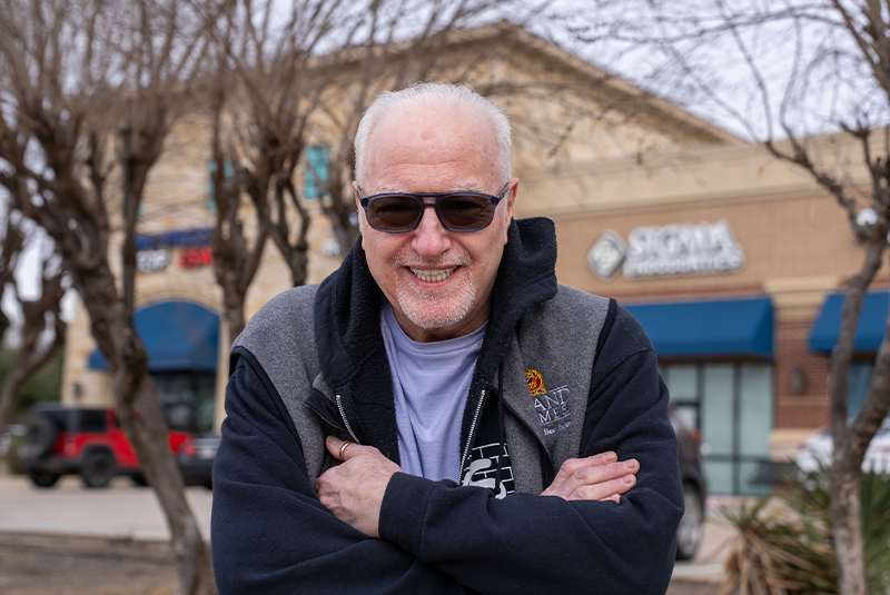 Dr. Najari's patient Joe smiling outside of the practice